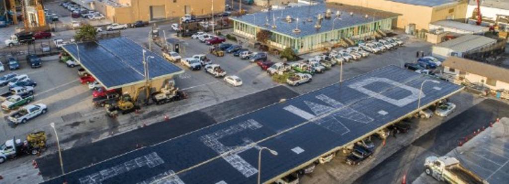 photograph of existing campus showing offices, machine shops and parking