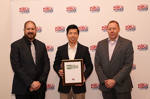 Danny Phung, Asset Manager in the Power Enterprise, accepting the APPA RP3 Gold Designation award.