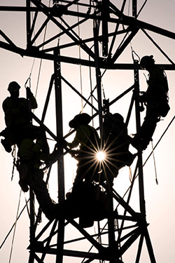 SFPUC crew members working on transmission lines. 