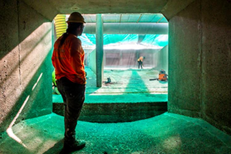 Workers cleaning an outfall structure