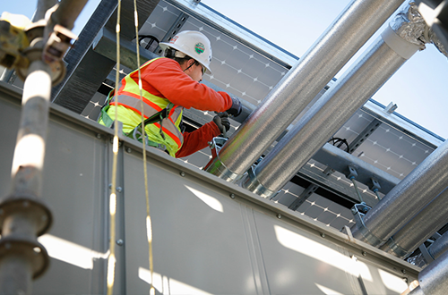 A construction worker and solar system