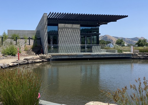 Photo of rear exit of Watershed Center building next to the freshwater pond