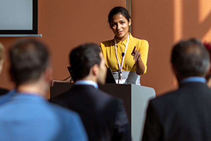 Woman speaking at public meeting