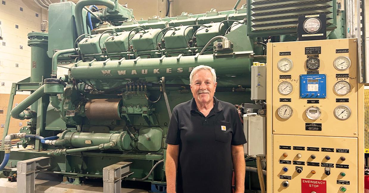 Frank Calvo in front of the diesel pump at the San Antonio Pump Station that saved the day.