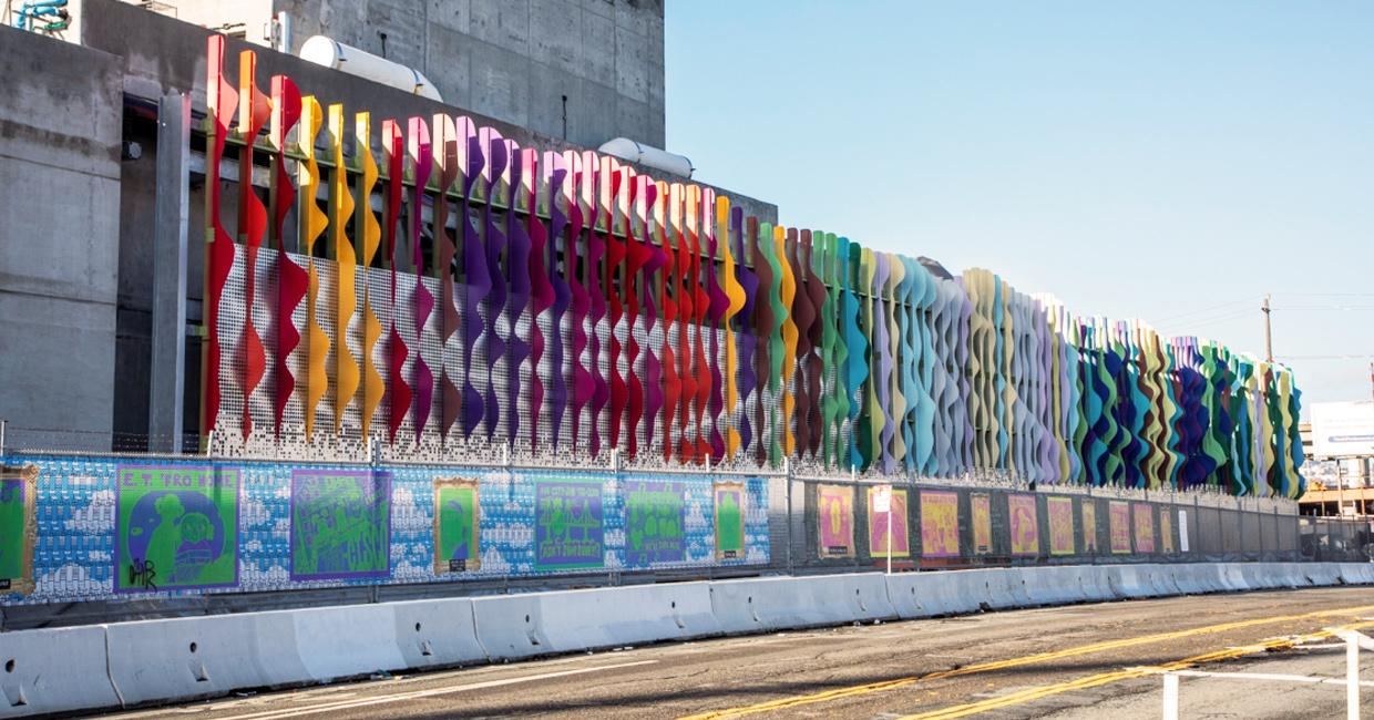 Norie Sato's Art Wall colorful metal against a building