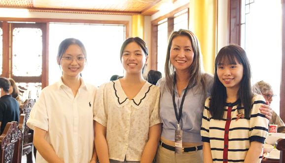 Megan (light blue shirt) and three young women who are part of COV's Bright Scholars program and attending college.