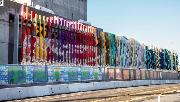 Norie Sato's Art Wall colorful metal against a building