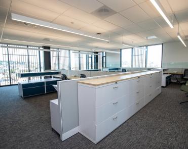 Suite 301-D storage cabinets and open office area with workstations